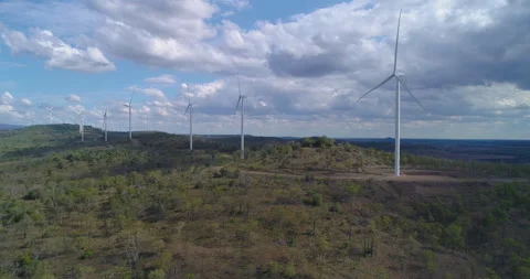 Hovering drone view of  Wind Turbines On Green Hills at wind farm,QLD,Australia Stock Footage 297586898