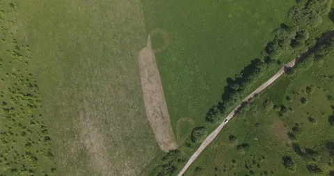 Hovering fly over fields and a road 스톡 동영상 108750016