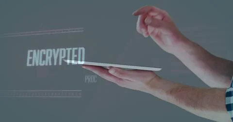 Hovering forearms tapping floating tablet in gray studio, showing ENCRYPTED Stock Photos