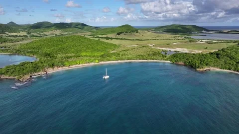 Hovering in front of Anse Meunier beach, while right panning to Salines Beach Stock Footage 324788111