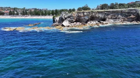 Hovering in front of Giles Bathe before flying around Stock Footage 329067630