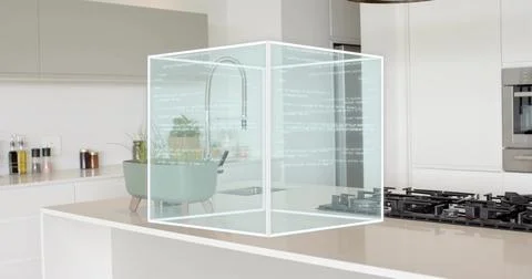 Hovering hologram cube showing code above island in kitchen, overlapping planter 库存照片