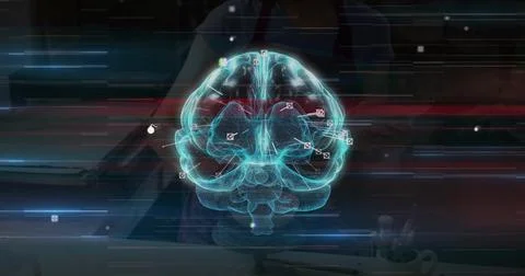 Hovering holographic brain model showing data markers over desk in dim lab, Stock Photos