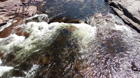 Hovering low above a little waterfall Stock Footage 158754926