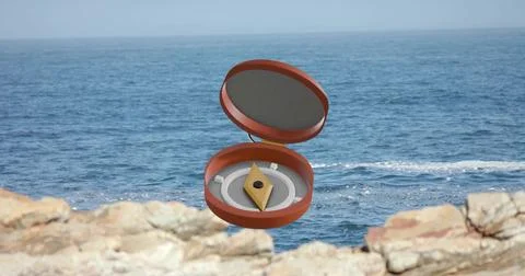 Hovering open orange compact with grey felt lining and gold diamond object above Stockfoto's