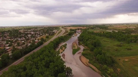 Hovering Over River and Road Facing South Color Corrected Stock Footage 98846776