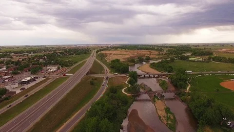 Hovering Over River at Bridge Facing South Color Corrected Stock Footage 98847053