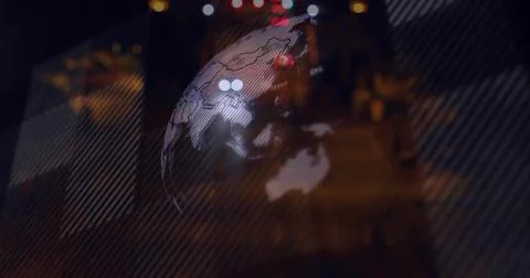 Hovering translucent globe projection over urban night street, showing continent Ilustração Stock