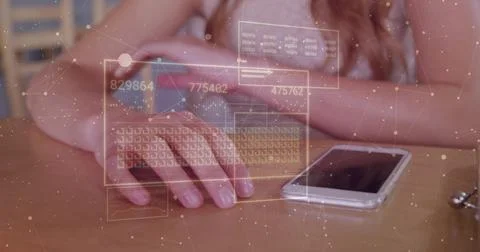Hovering woman's hands wearing grey tank top using AR interface at wooden table, Stock Photos