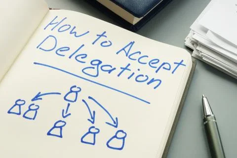 How to accept delegation. Note pad and pen. Stock Photos