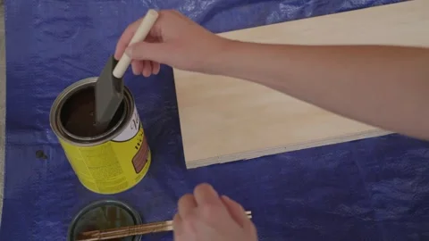 How to apply stain with precision brushwork Stock Footage 311122750
