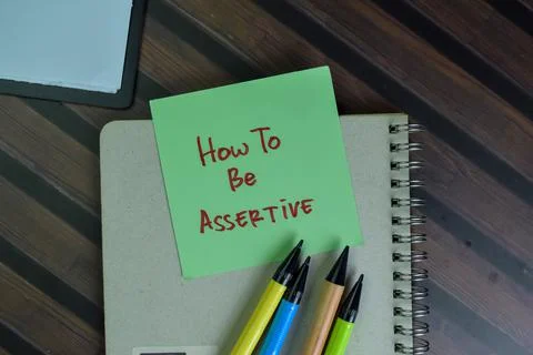 How to be Assertive write on sticky notes isolated on Wooden Table. Stock Photos