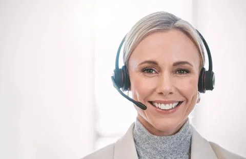 How can I help you. Cropped portrait of an attractive mature female call center Stock Photos