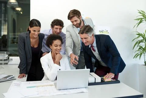 How can we optimize our business processes. a group of businesspeople working Stock Photos