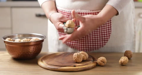How to crack open a walnut without breaking your teeth Video stock 235389635