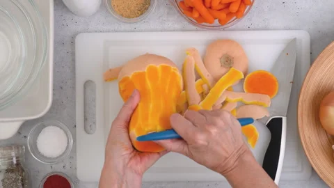 How to cut and peel squash, preparation process, woman hands, flat lay Stock Footage 279955657