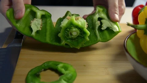 How to cut bell pepper. cook cuts green pepper Stock Footage 123347171