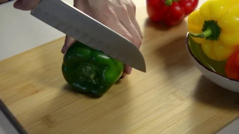 How to cut bell pepper. cook cuts green pepper Stock Footage 123347173