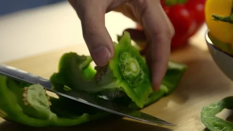 How to cut bell pepper. cook cuts green pepper Stock Footage 123347177