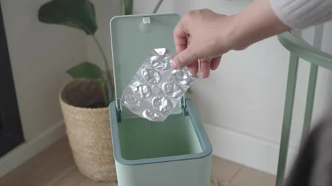How to dispose of empty pill packs properly in your home Stock Footage 336983905
