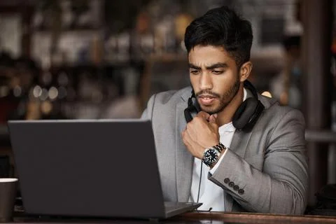 How do I solve this issue. a young businessman working in a cafe. Stock Photos
