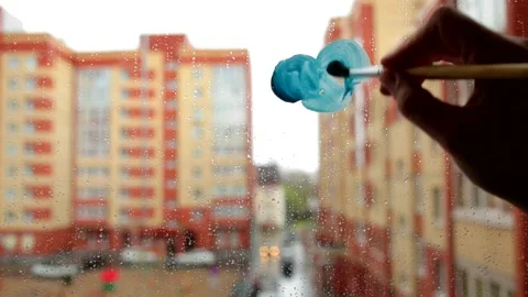 How to draw a cloud with paint and brush on a window.Step 1 Stock Footage 130825408