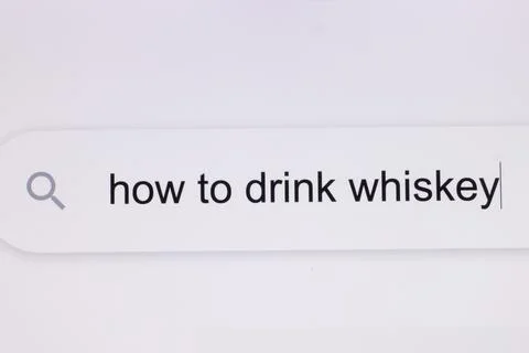 How to drink whiskey - pc screen internet browser search engine bar typing Stock Photos