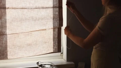 How to Easily Adjust Window Shades for Better Lighting at Home Stock Footage 319781460