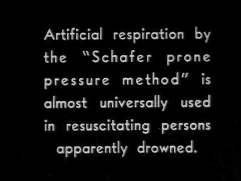 How to effectively apply artificial respiration on a unconscious swimmer onceƒ Stock Footage 75299969