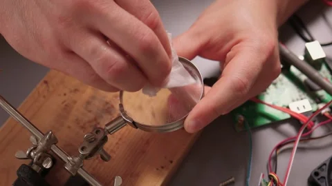 How to Effectively Clean a Magnifying Glass for Precise Precision Tasks and Work Stock Footage 316949636
