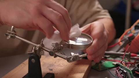 How to Effectively Clean a Magnifying Glass for Precise Precision Tasks and Work Stock Footage 316950070