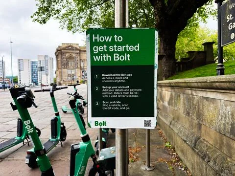 How to get started with Bolt e scooters next to historic buildings in Liver.. Stock Photos