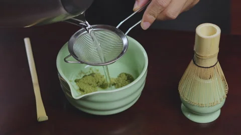 How to home made matcha tea mix with soy milk. Making Japanese matcha tea. .. Stock Footage 322513233