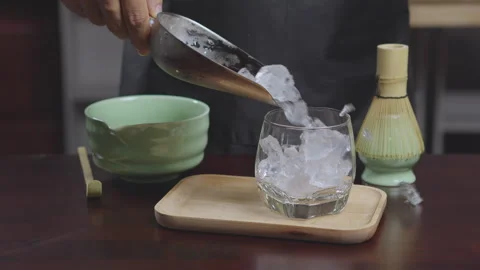 How to home made matcha tea mix with soy milk. Making Japanese matcha tea. .. Stock Footage 322513614