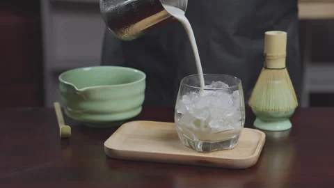 How to home made matcha tea mix with soy milk. Making Japanese matcha tea. .. Stock Footage 322513922