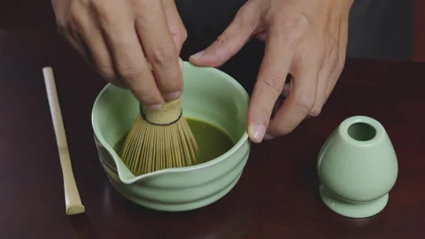 How to home made matcha tea mix with soy milk. Making Japanese matcha tea. .. Stock Footage 322514181