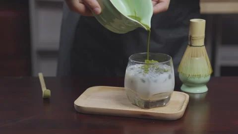 How to home made matcha tea mix with soy milk. Making Japanese matcha tea. .. Stock Footage 322514626