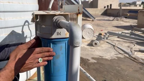How to Install and Secure a Water Filter Housing Video stock 345611700