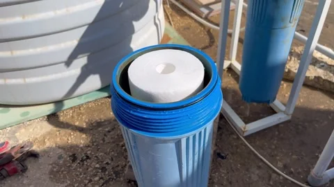 How to Install a Sediment Filter Cartridge in a Water Filtration System Stock Footage 345611672