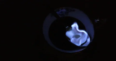 How to make Cafe royal cocktail : blue flames on lumps of sugar are swaying Stock Footage 116548650