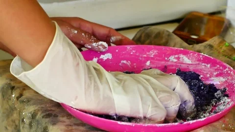 How to make colored powder, holi Festival. The hands are salting food colorin Stock Footage 83473281