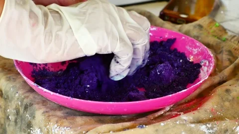 How to make colored powder, holi Festival. The hands are salting food colorin Stock Footage 83473377