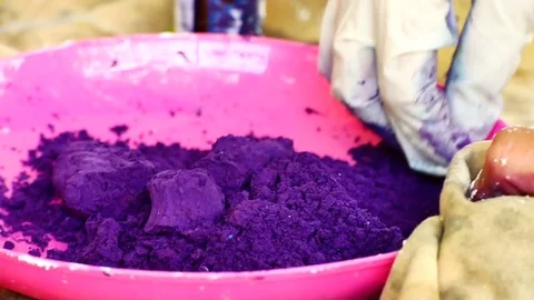 How to make colored powder, holi Festival. The hands are salting food colorin Stock Footage 83473437