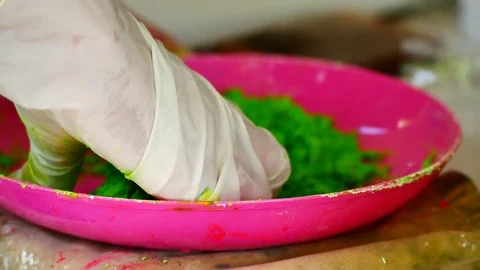 How to make colored powder, holi Festival. The hands are salting food colorin Stock Footage 83473465