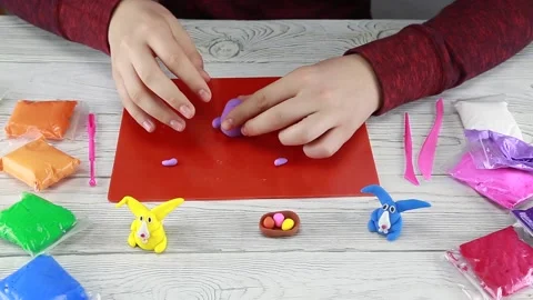 How to make an Easter bunny out of plasticine. Step 1 Stock Footage 148530703