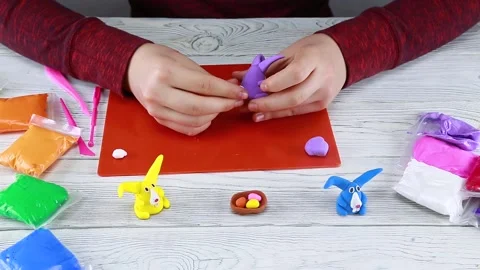 How to make an Easter bunny out of plasticine. Step 5 Stock Footage 148530705