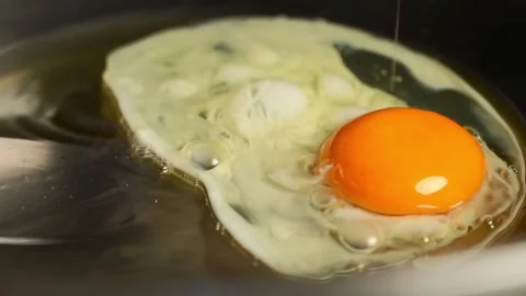 How to Make a Fried Egg for Breakfast Video stock 330280081