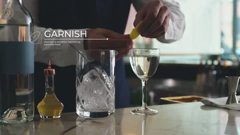 How to make a Martini Part 7 of 7: A barkeep serves the mixed cocktail in a clas Stock Footage 199462383