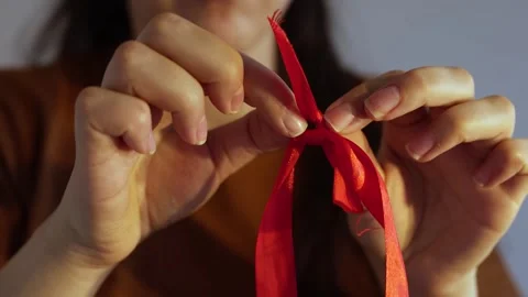 How to make red ribbon bow Stock Footage 245011344