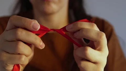 How to make red ribbon bow Stock Footage 245011389
